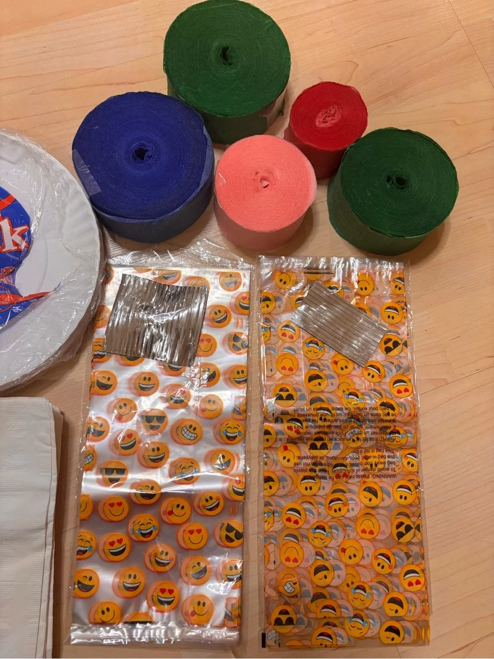 Value Pack White Party Plates with Emoji Treat Bags and Multicolor Streamers